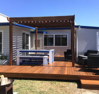 Shellharbour Beach Cottage - walk onto Patrolled beach with flags in summer - Accommodation Gladstone